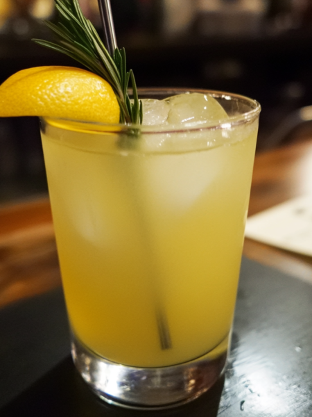 a glass of fresh lemonade on a table outside